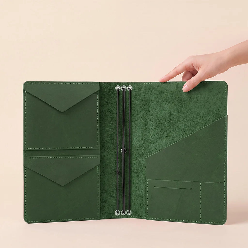 Refillable notebook organizer crafted from leather with premium elastic insert retention.