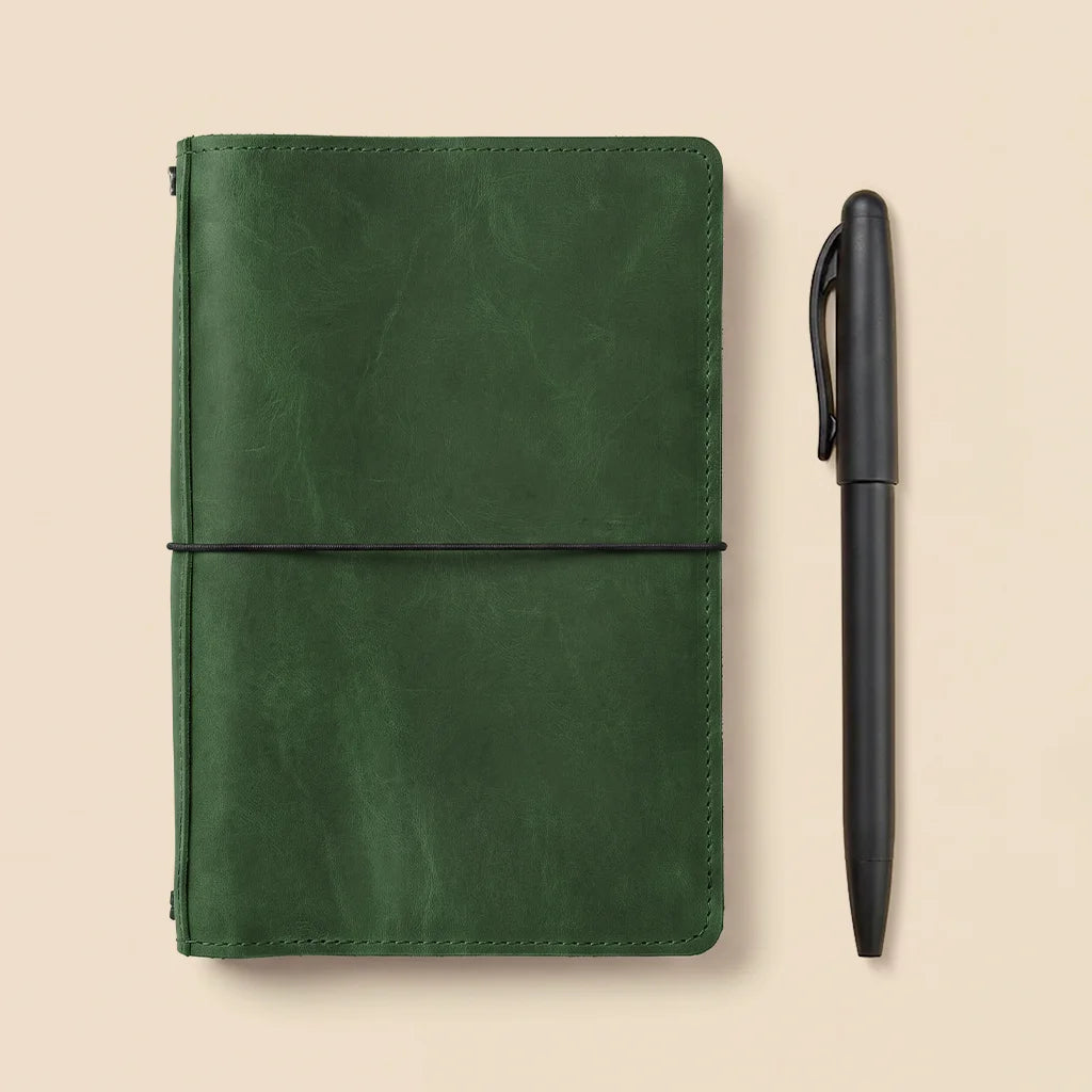 Refillable leather journal cover with practical pockets and elastic bands for inserts.