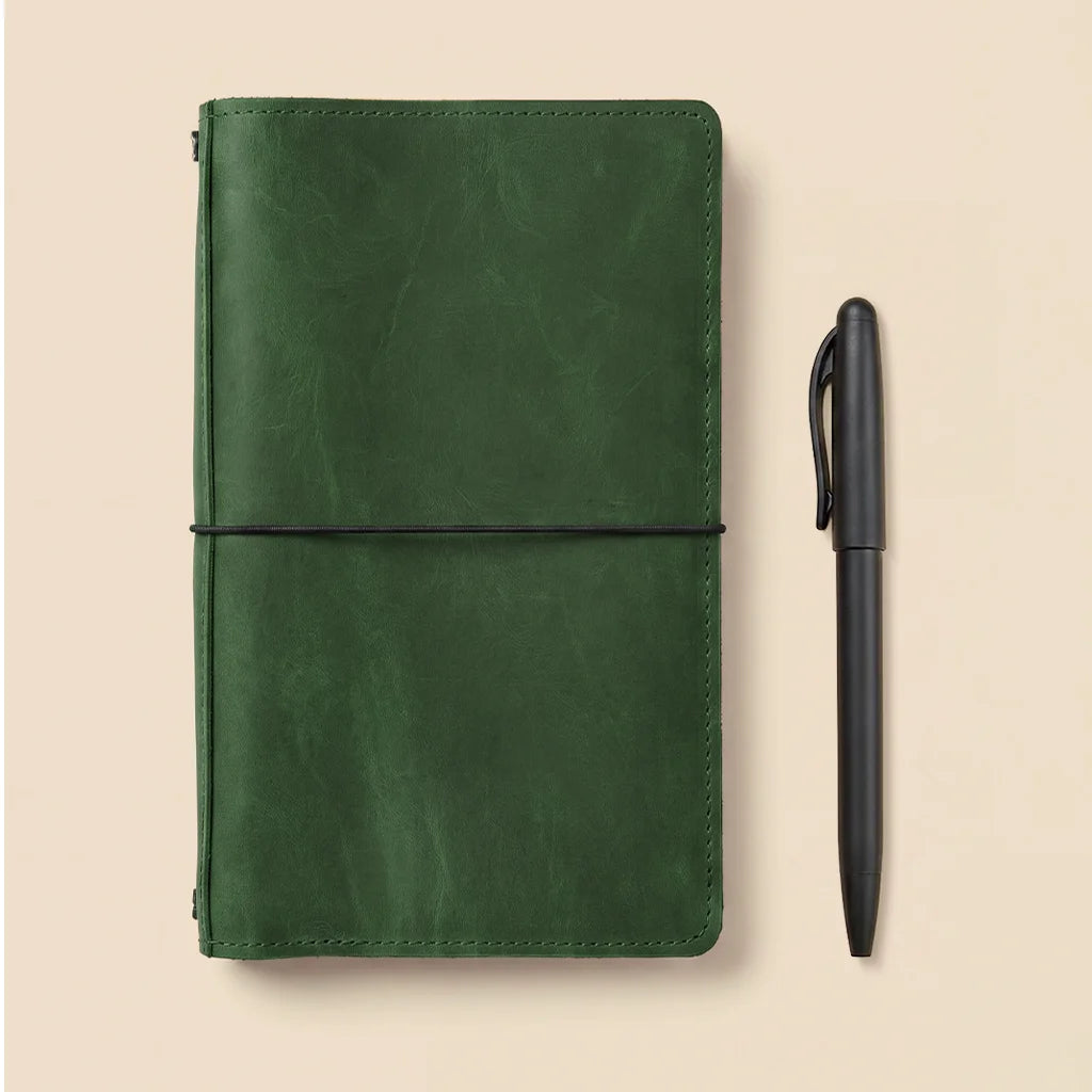 Genuine leather notebook sleeve featuring elastic insert holders and practical organizer pockets.