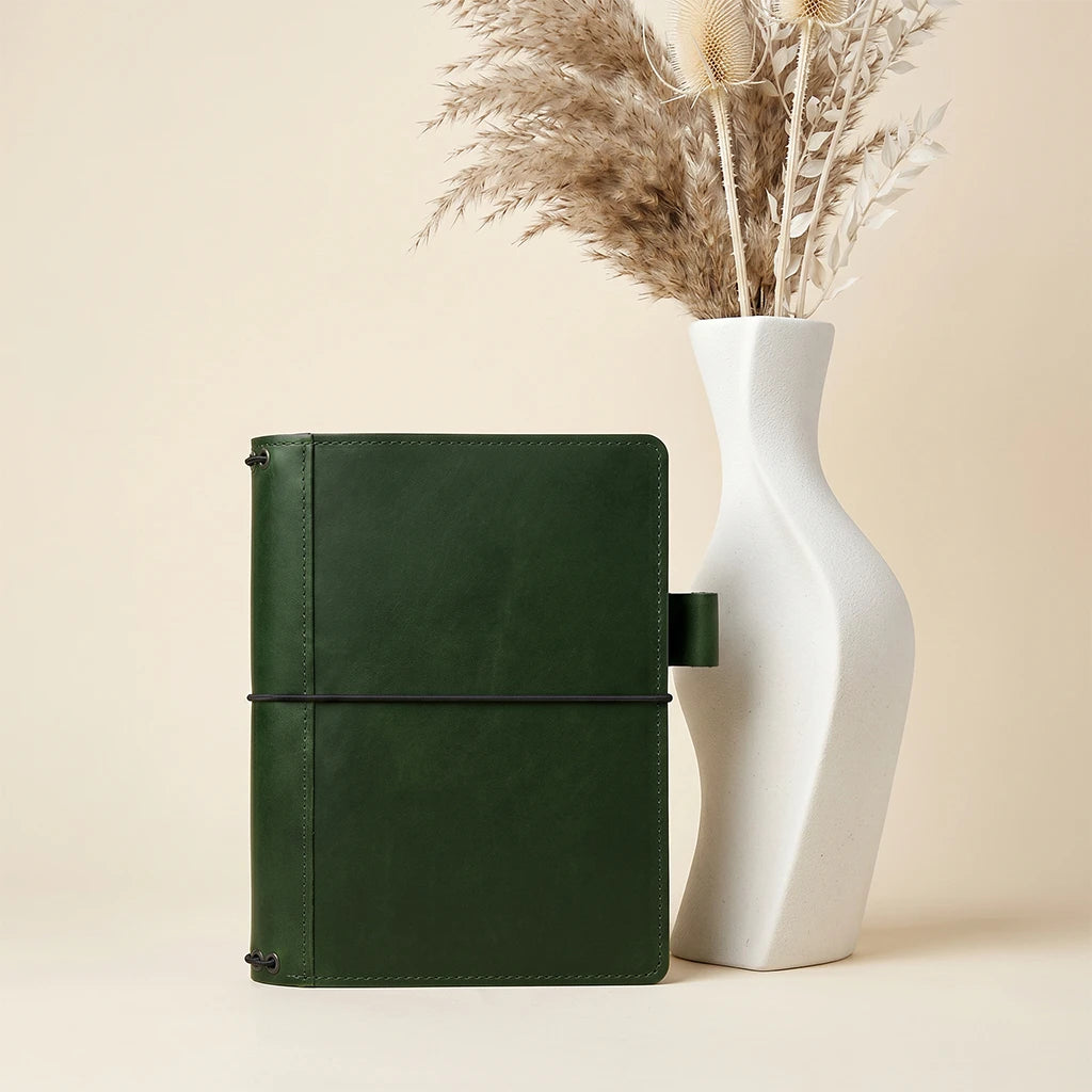 Leather notebook wrap featuring refillable design and secure elastic holders