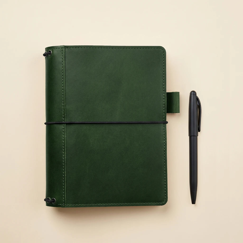 Handmade leather notebook wrap with practical pockets and refillable design