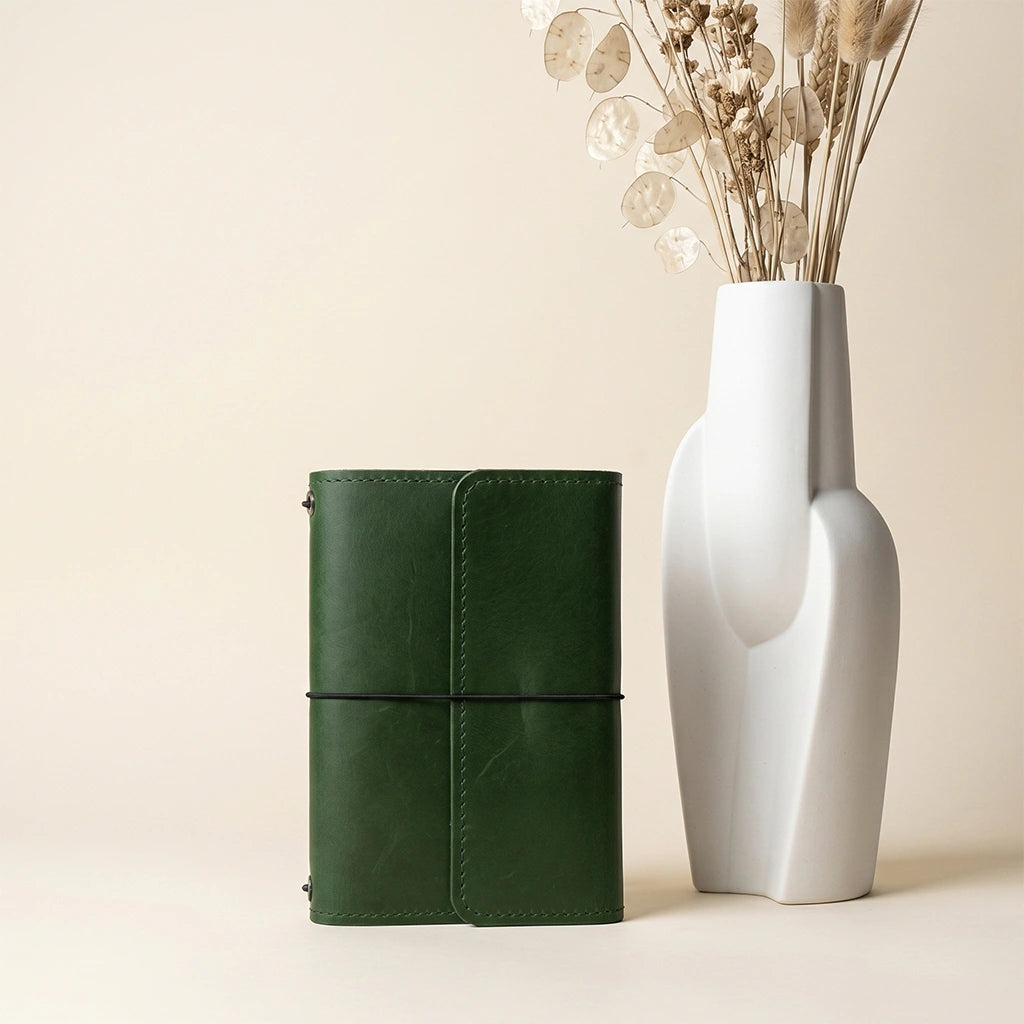 Refillable leather journal cover with premium craftsmanship and practical organizer pockets.