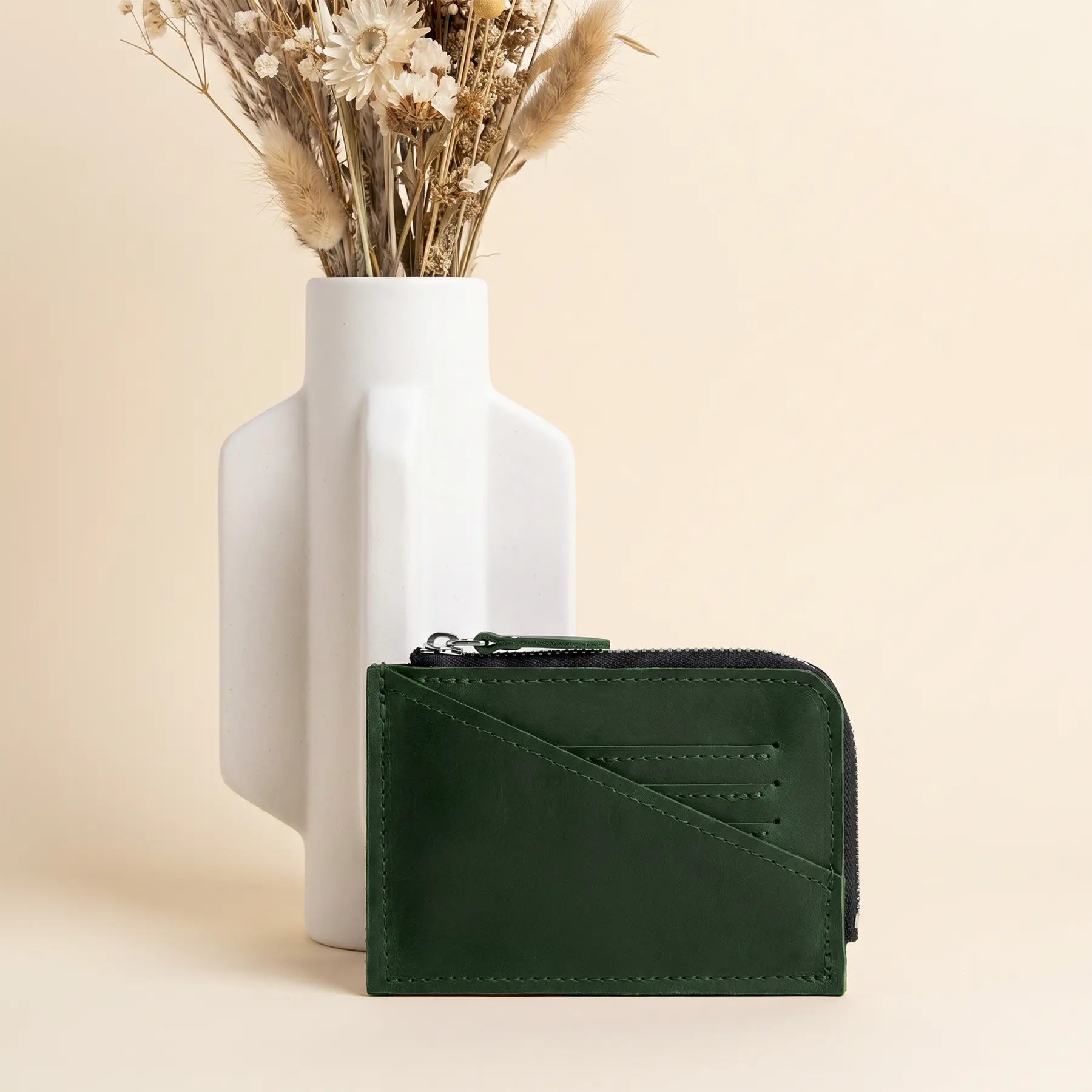 Small full grain leather wallet with durable zipper and handcrafted finish for everyday carry.
