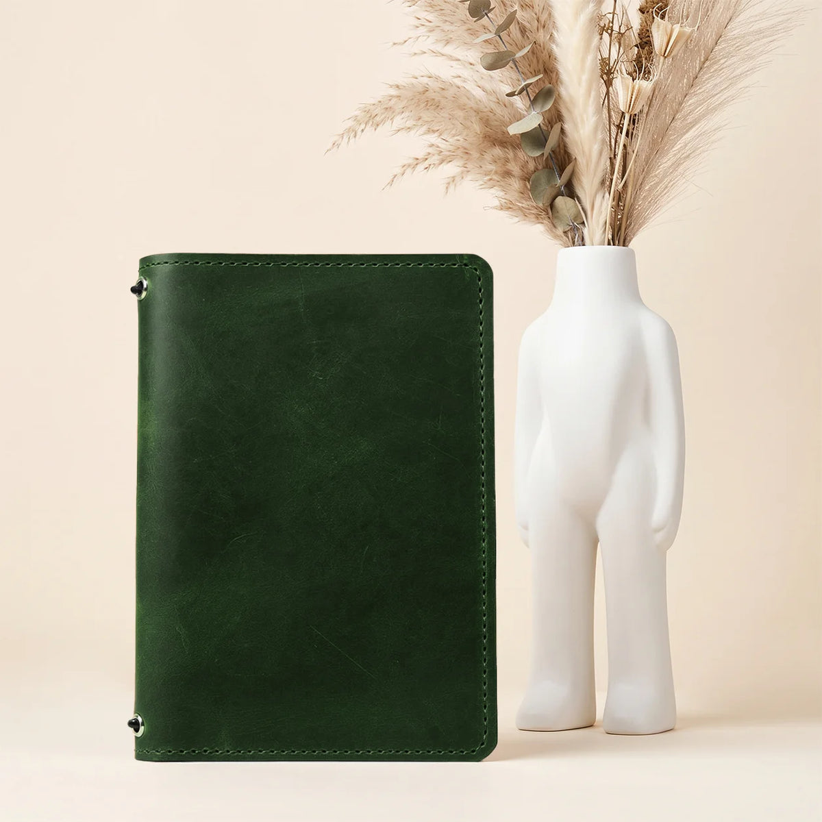 Genuine leather planner case displaying Crazy Horse texture, two retaining straps, and pockets