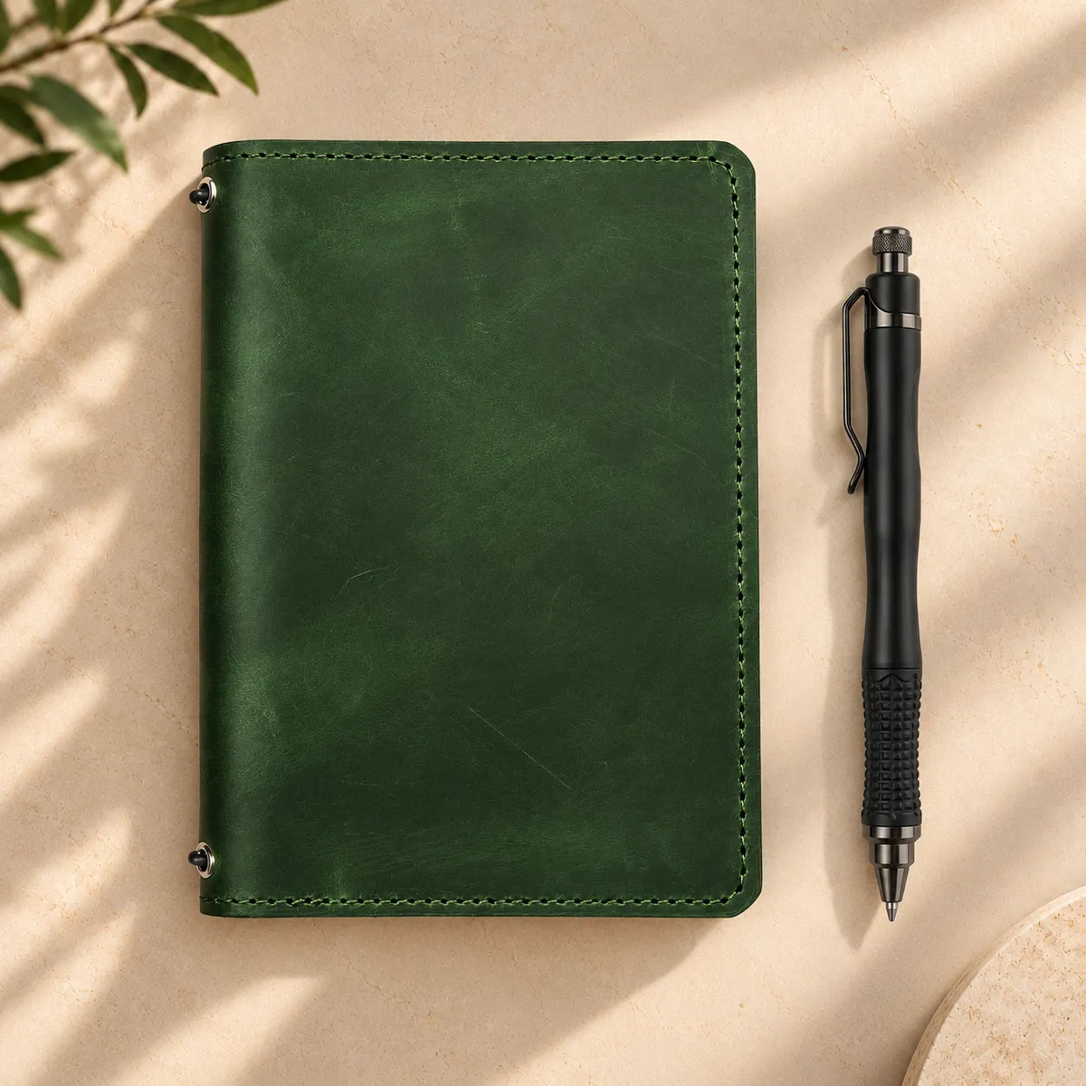 Handmade leather journal cover with two elastic bands and useful storage pockets inside.