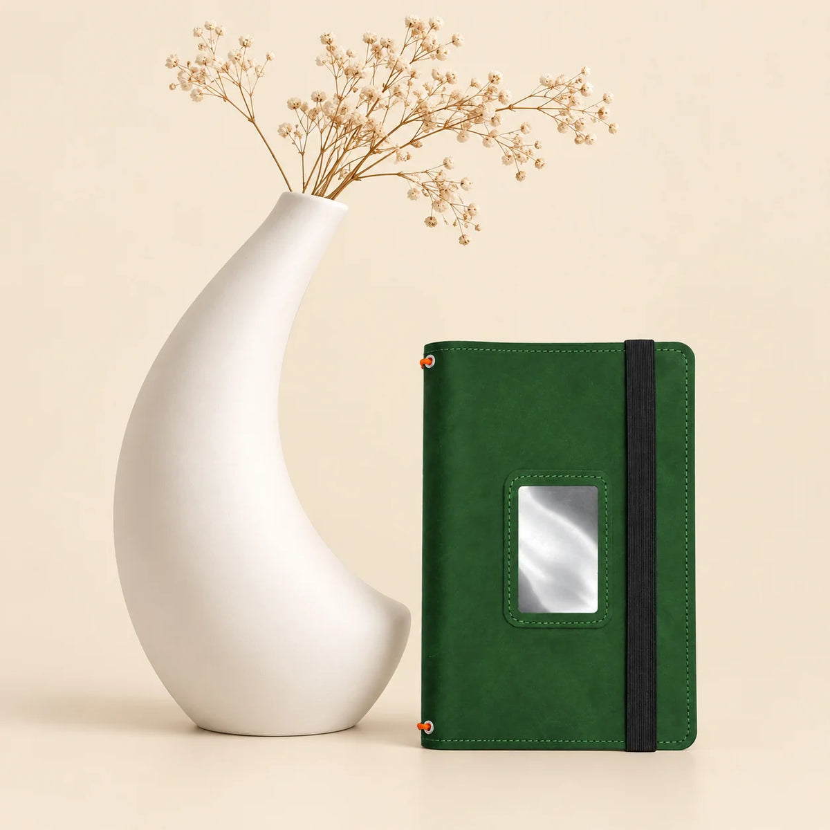 Handmade leather journal case with three notebook bands and dedicated storage compartments.