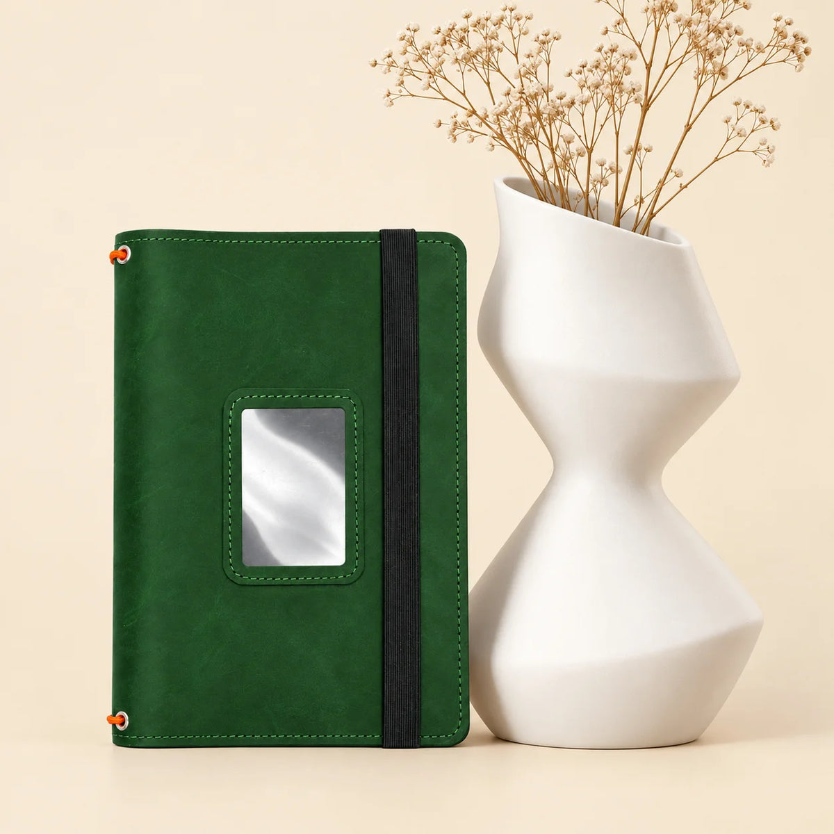 Leather notebook cover featuring three elastic bands and spacious interior pockets for organization.