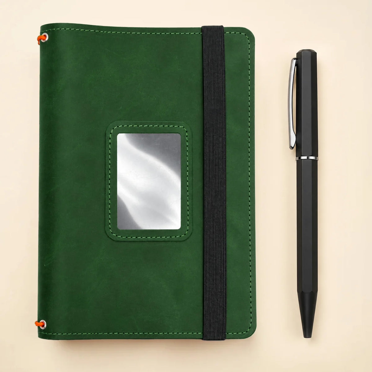 Handmade genuine leather journal cover with three elastic bands and convenient storage pockets.