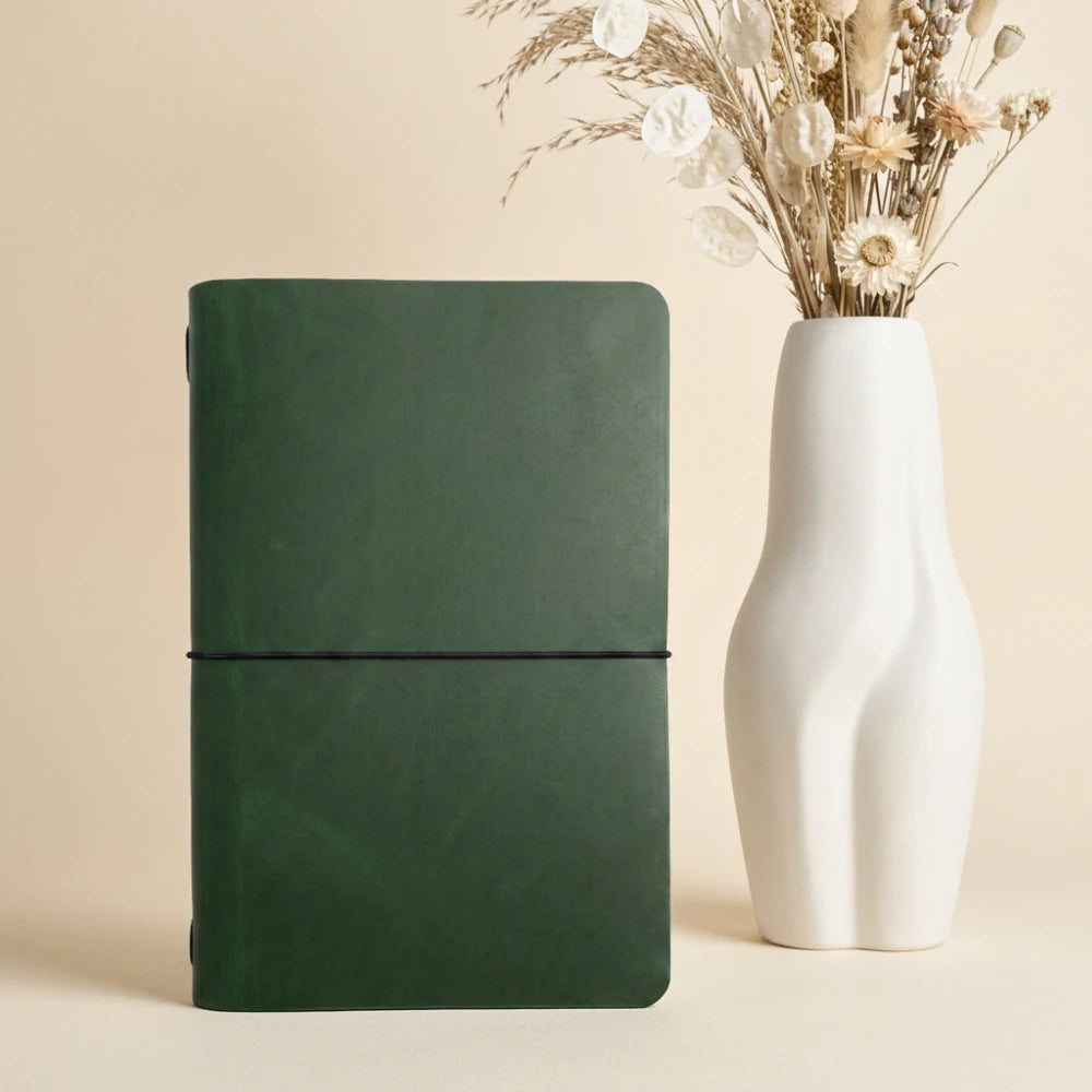 Classic leather notebook holder featuring handcrafted details and one interior elastic band.