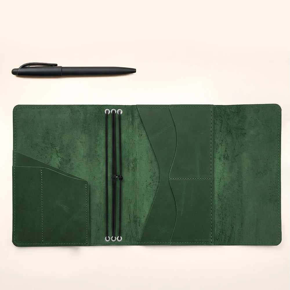Refillable leather notebook protector with interior card slots and secure elastic notebook holders.