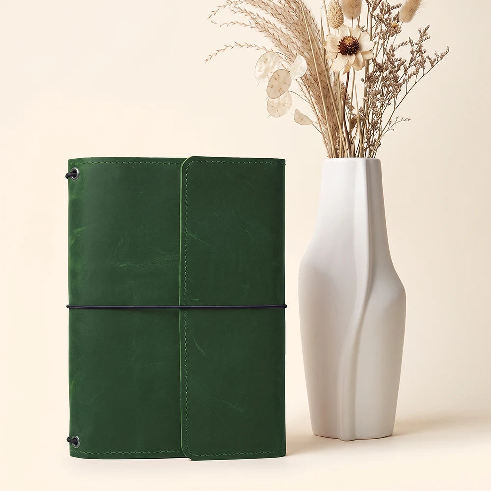 Genuine leather writing notebook cover with practical storage pockets and refillable elastic system.