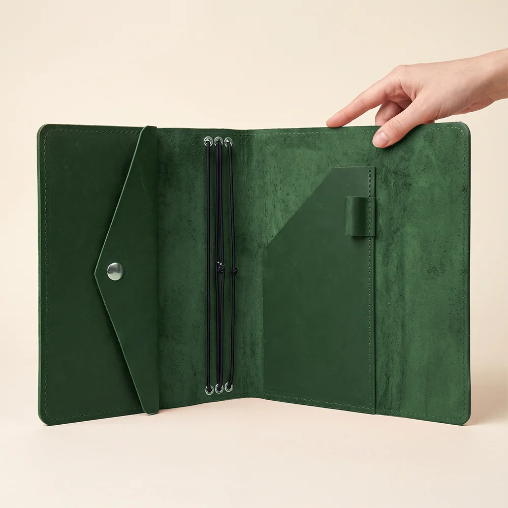 Premium handcrafted notebook cover offering organized storage for planners and travel journals.