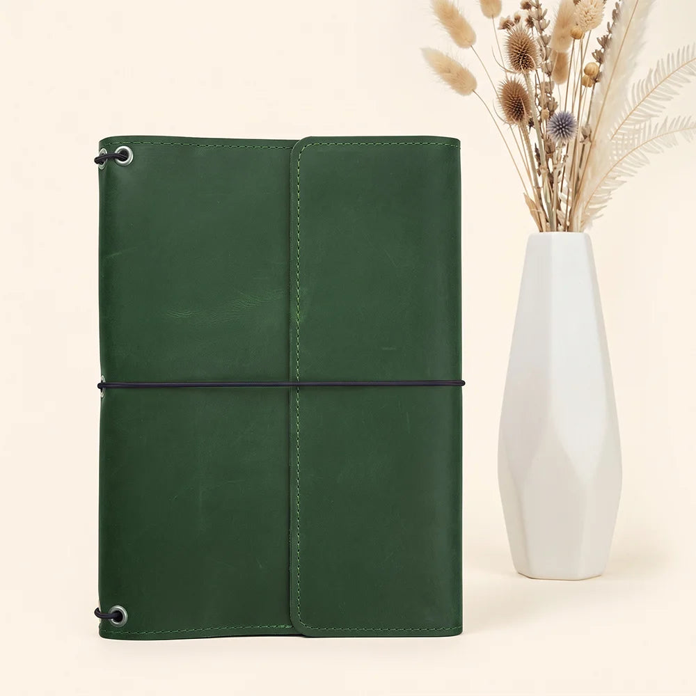 Leather planner portfolio with refillable notebook system and handcrafted attention to every detail.