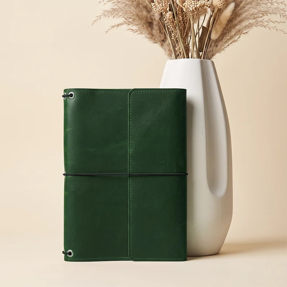 Leather notebook organizer handcrafted from full grain leather with secure elastic notebook retention.