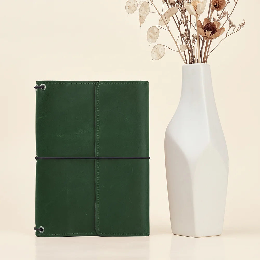 Leather notebook cover designed for efficient organization with pockets, elastics, and premium craftsmanship.