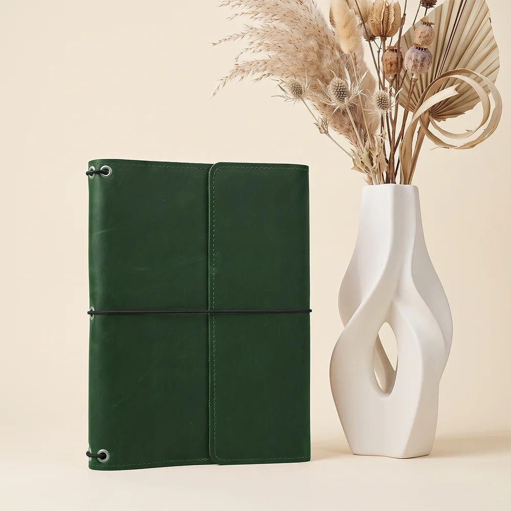Genuine leather notebook portfolio featuring refillable construction and multiple practical storage sections.