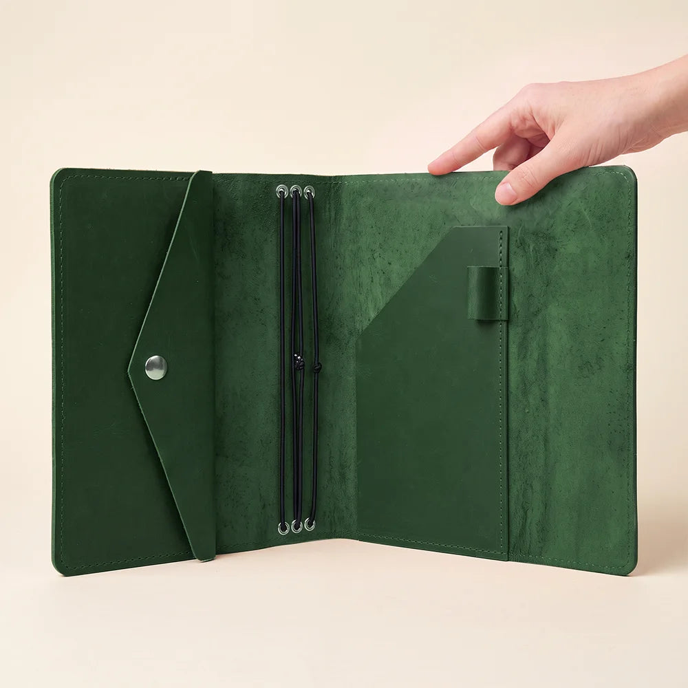 Premium handcrafted leather notebook organizer featuring spacious pockets and refillable insert functionality.