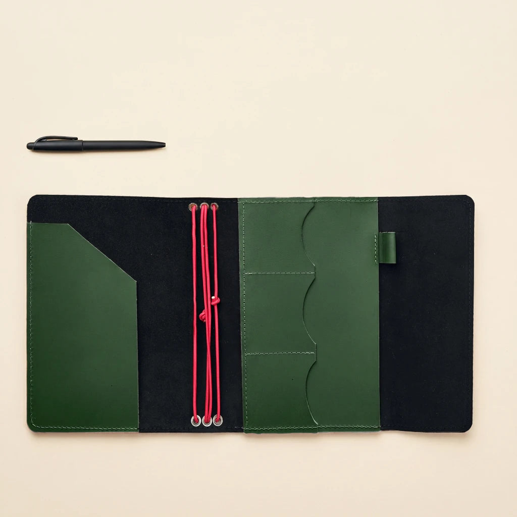 Functional leather journal case with elastic straps, storage pockets, and pen loop feature