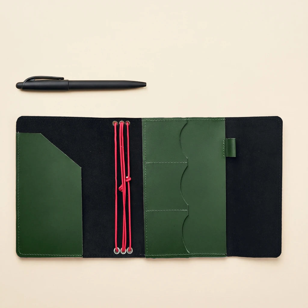 Minimalist leather notebook cover with elastic straps, useful pockets, and pen loop
