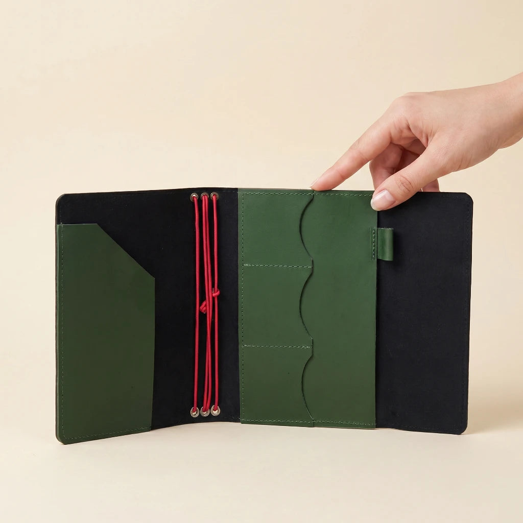 Handmade leather travel journal cover with elastic closure and practical inner pockets