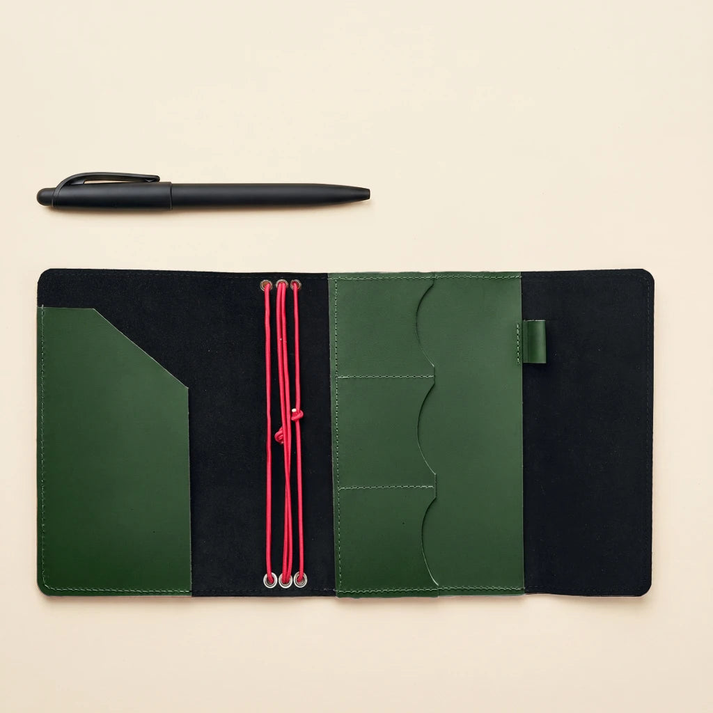 Leather travel notebook cover with elastic straps and rustic handmade appearance