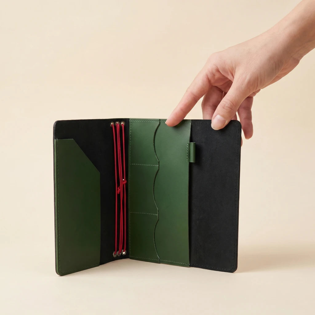 Stylish leather notebook sleeve with elastic bands and refillable journal design