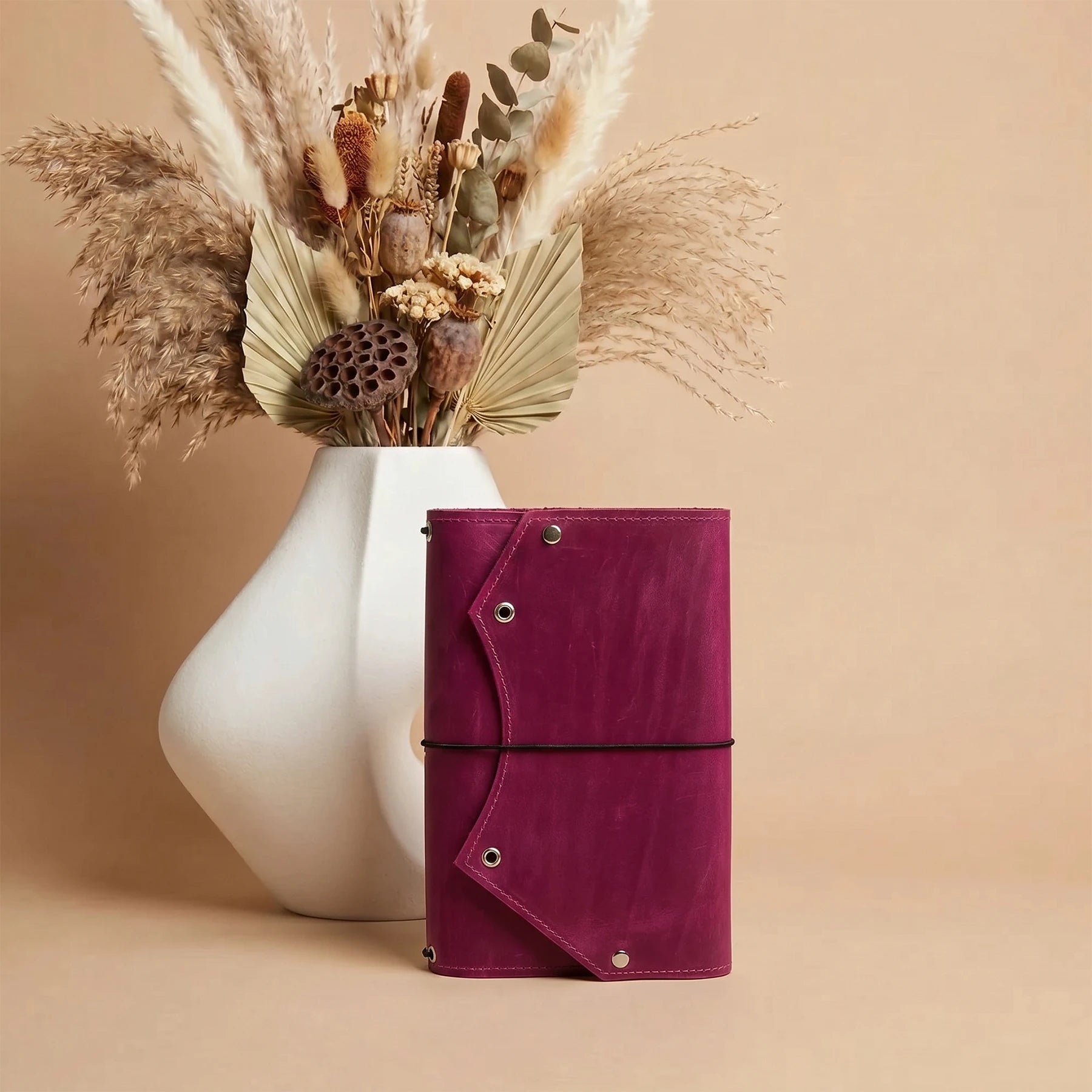 Handmade leather planner cover with practical zippered pocket for notes and important items.