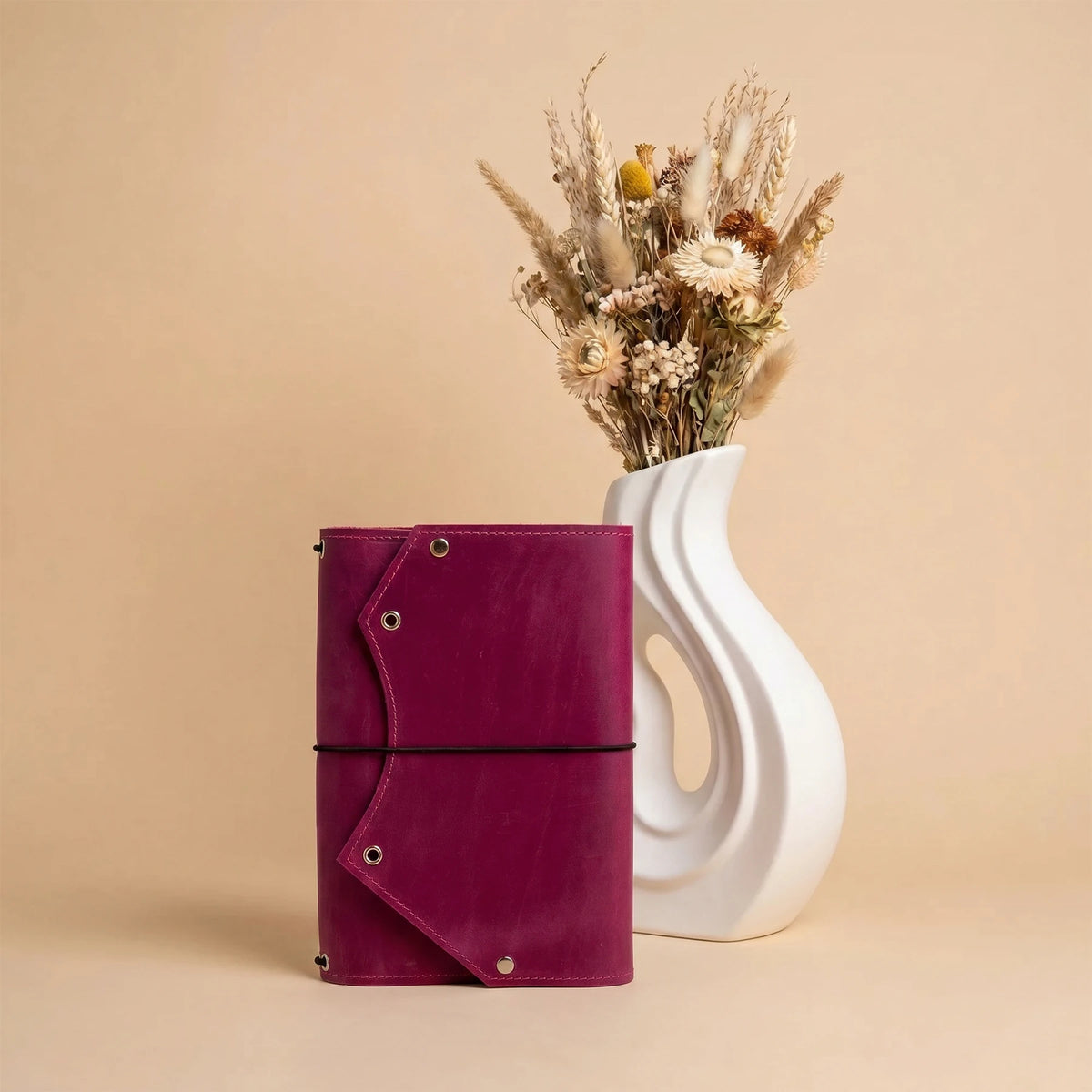 Rustic leather notebook cover showcasing a functional zipper pocket inside for extra storage.