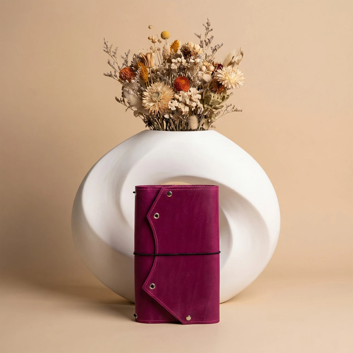 Elegant leather notebook cover featuring spacious zip pocket for personal items and documents.