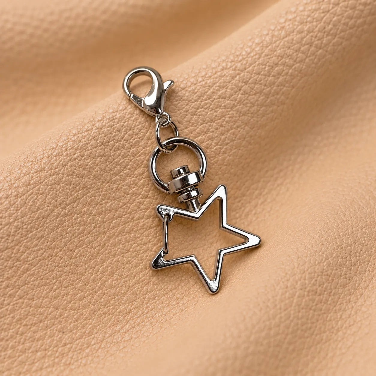 Decorative star bead charm for leather journal elastic bands and planner accessories.