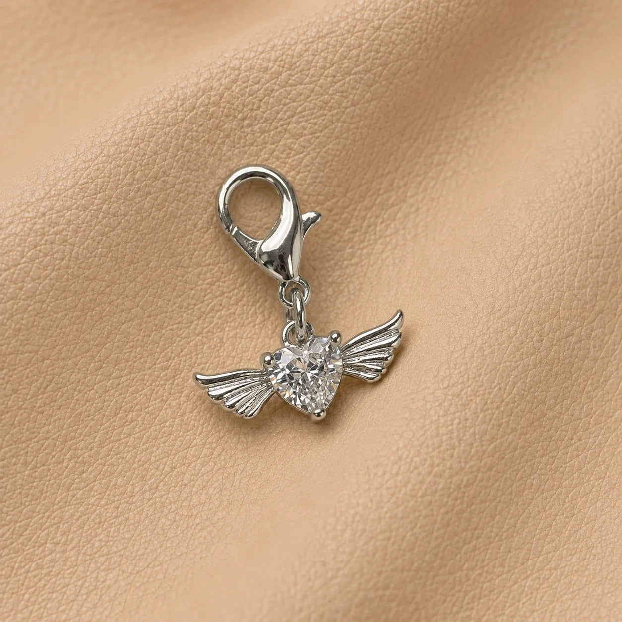 Decorative heart journal charm with metal clasp, stylish notebook elastic accessory for planners and journals.
