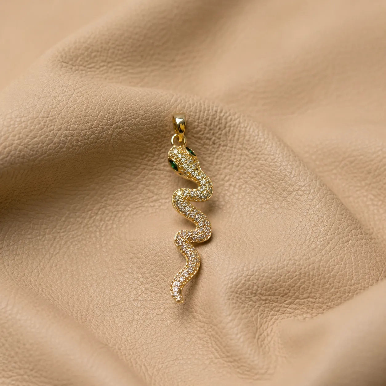 Snake journal charm attached to elastic notebook band with polished metal clasp accessory