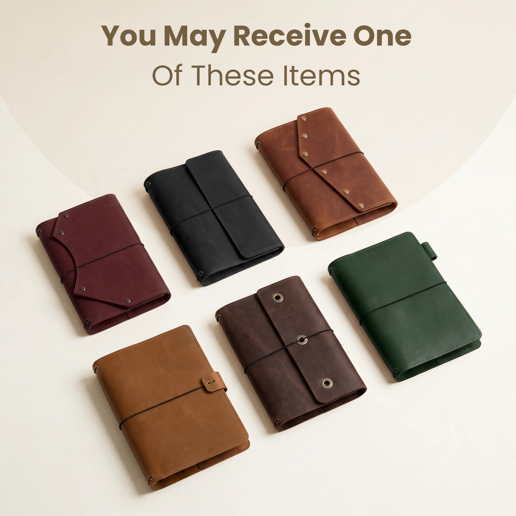Set of six leather-bound notebooks in different colors on a light background