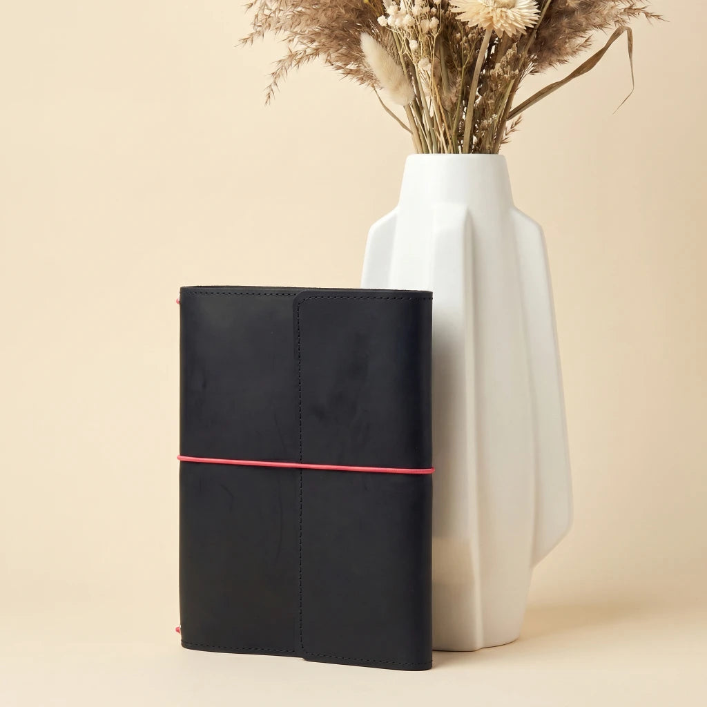 Rustic handmade notebook cover with elastic fastening and convenient pen loop