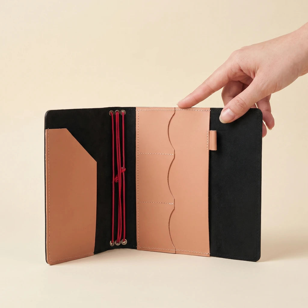 Handmade leather notebook cover with elastic bands, card pockets, and convenient pen loop