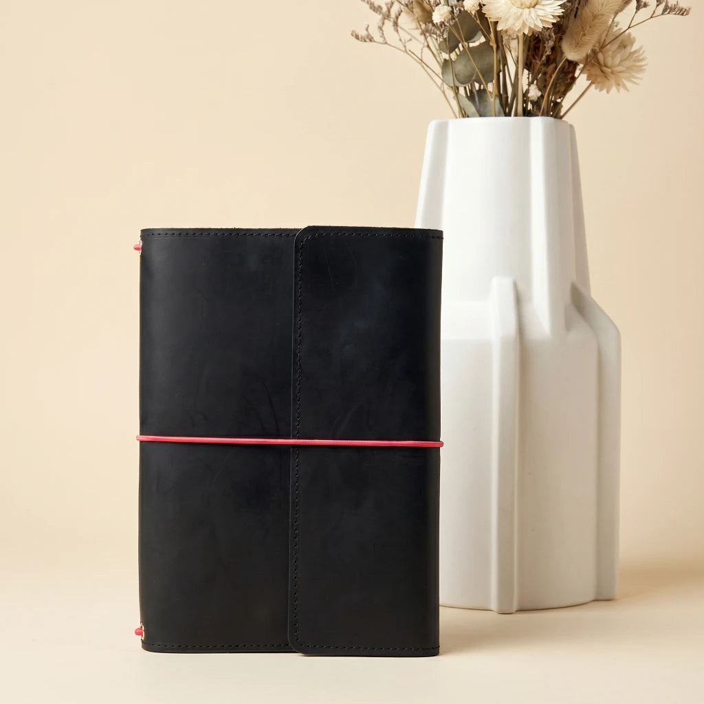 Genuine leather notebook cover secured with elastic bands for daily organization