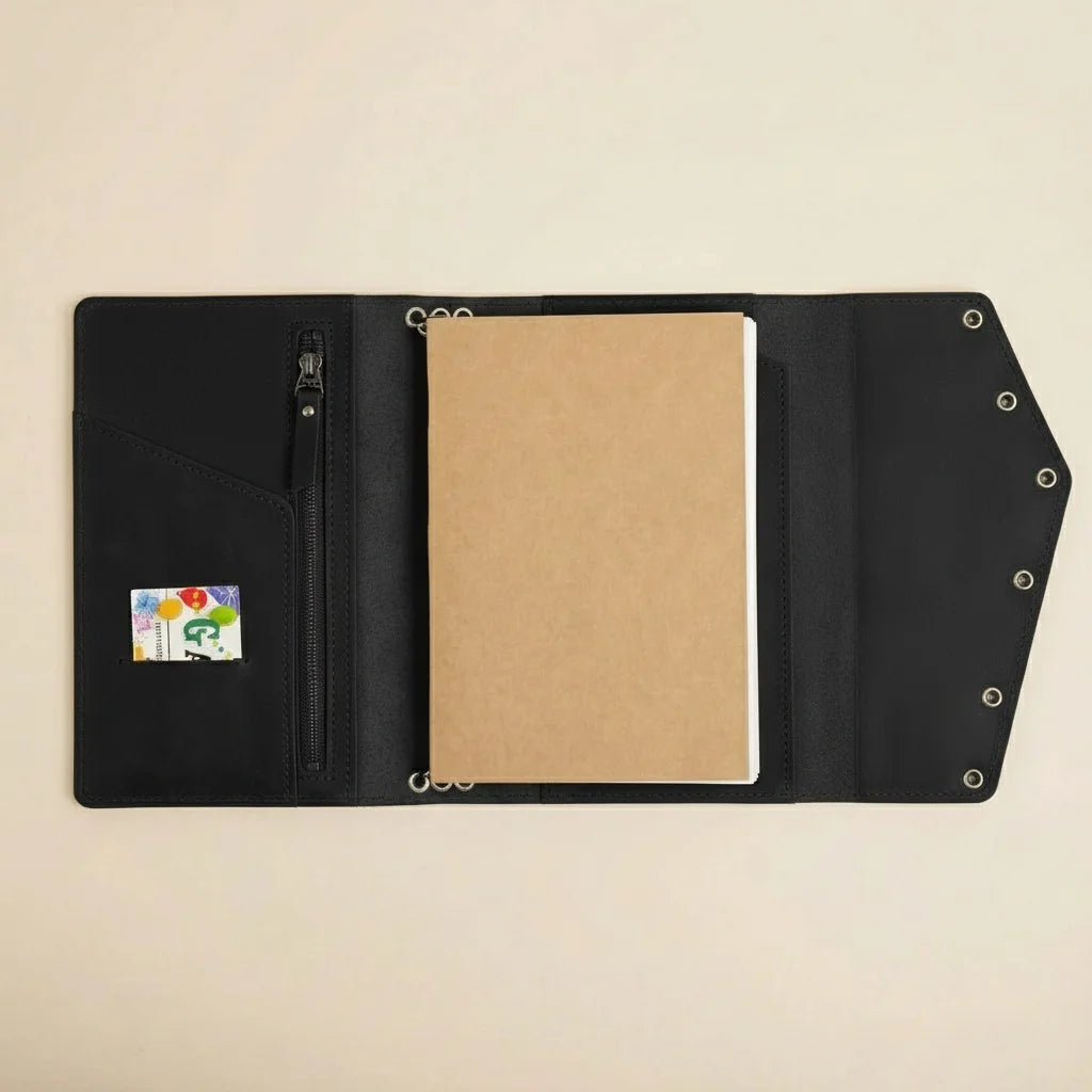 Black leather wallet with a brown cardholder and a small pouch on a beige background
