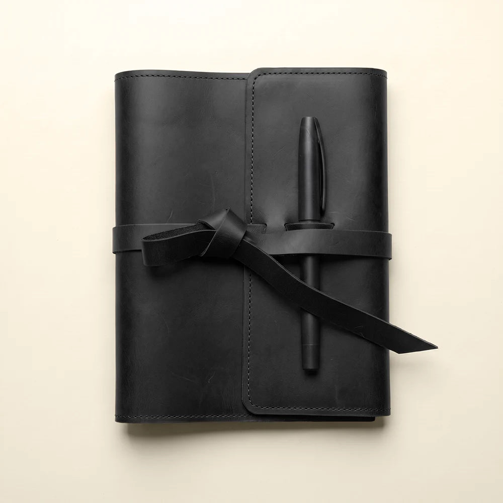 Durable leather journal organizer featuring card compartments and pen holder.
