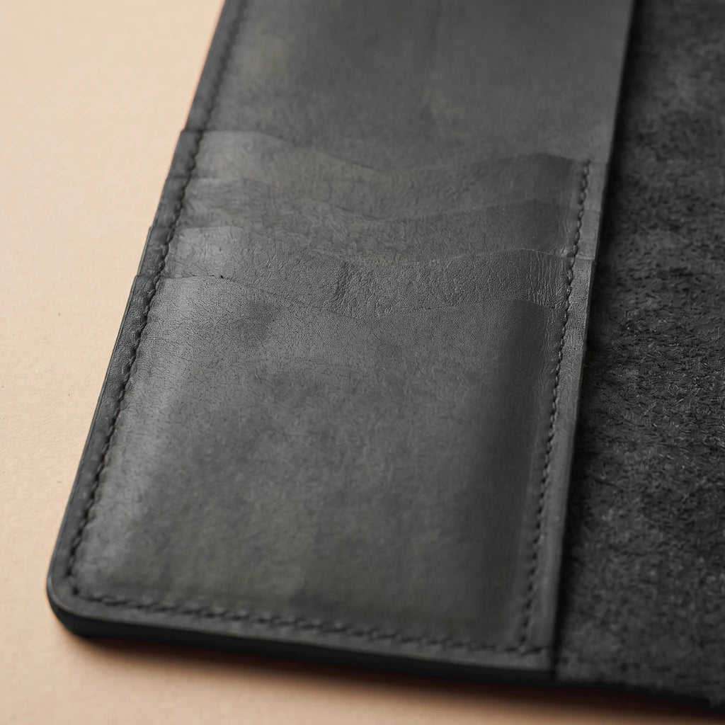 Leather organizer designed to keep notebooks neatly secured and accessible