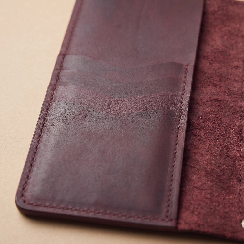 Stylish leather cover with elastic notebook system and compartments