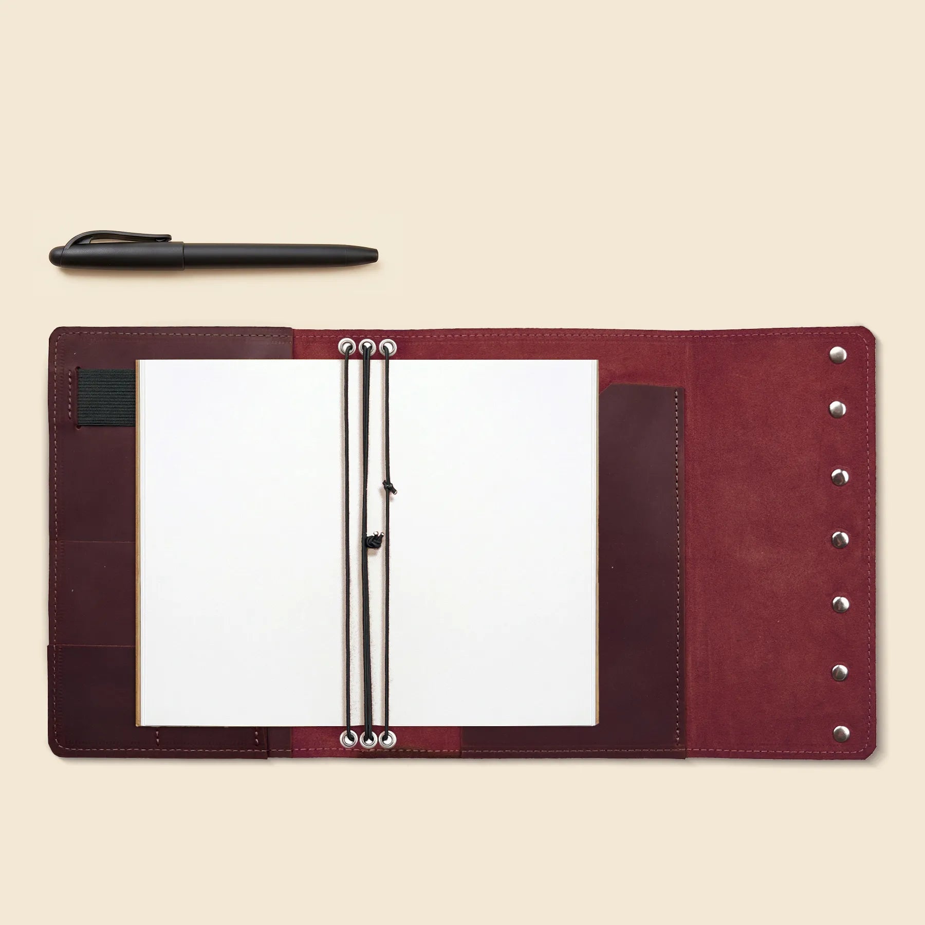 Genuine leather travel journal cover with organizer pockets and elastics.