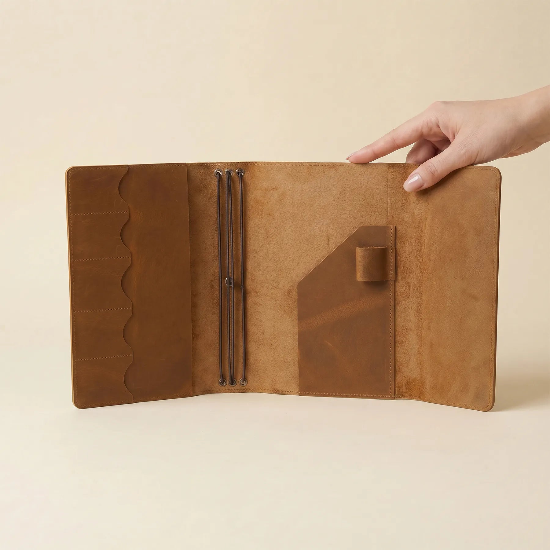 Premium leather journal cover with inner storage pockets and elastics.