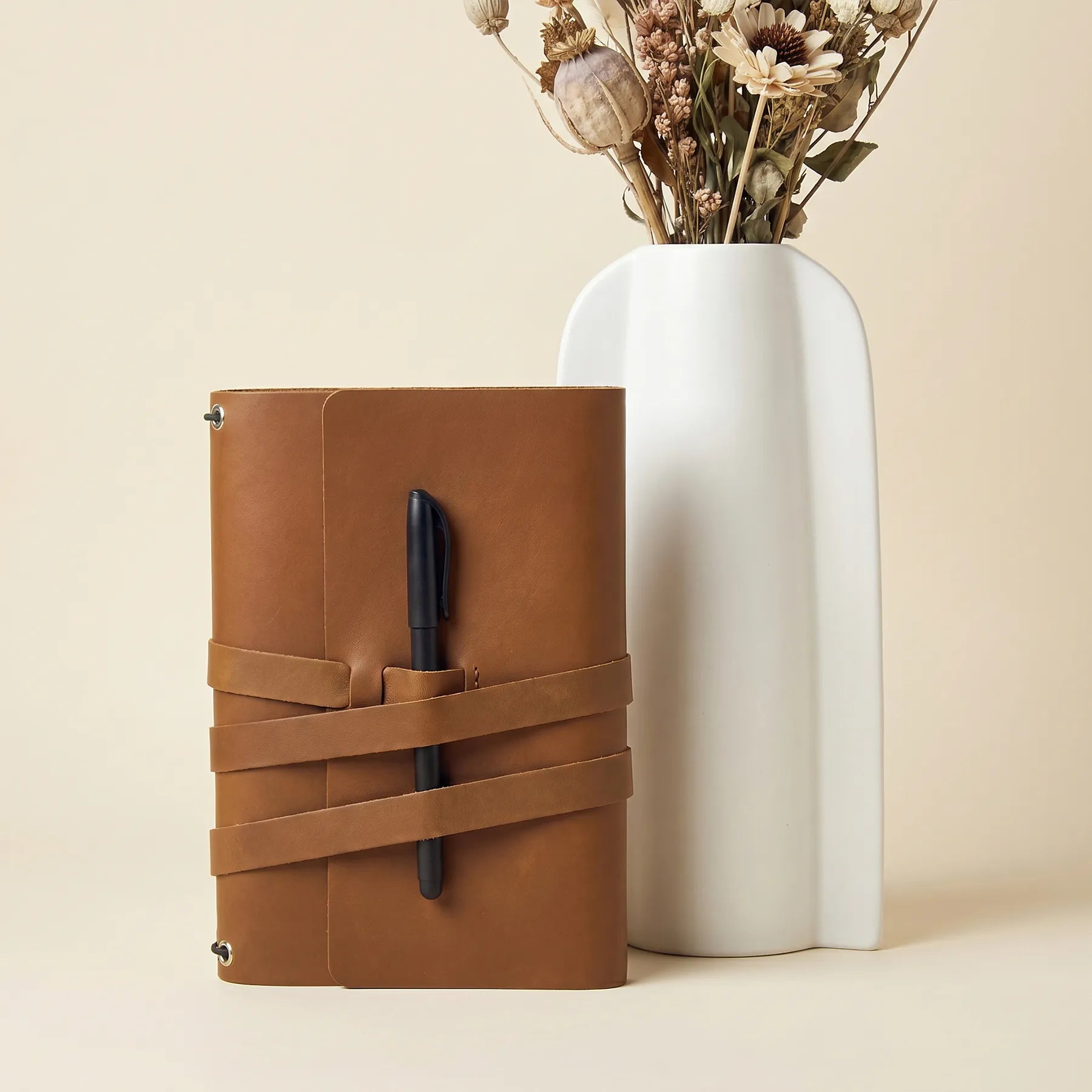 Genuine leather notebook cover designed with pen loops and handcrafted attention to detail.