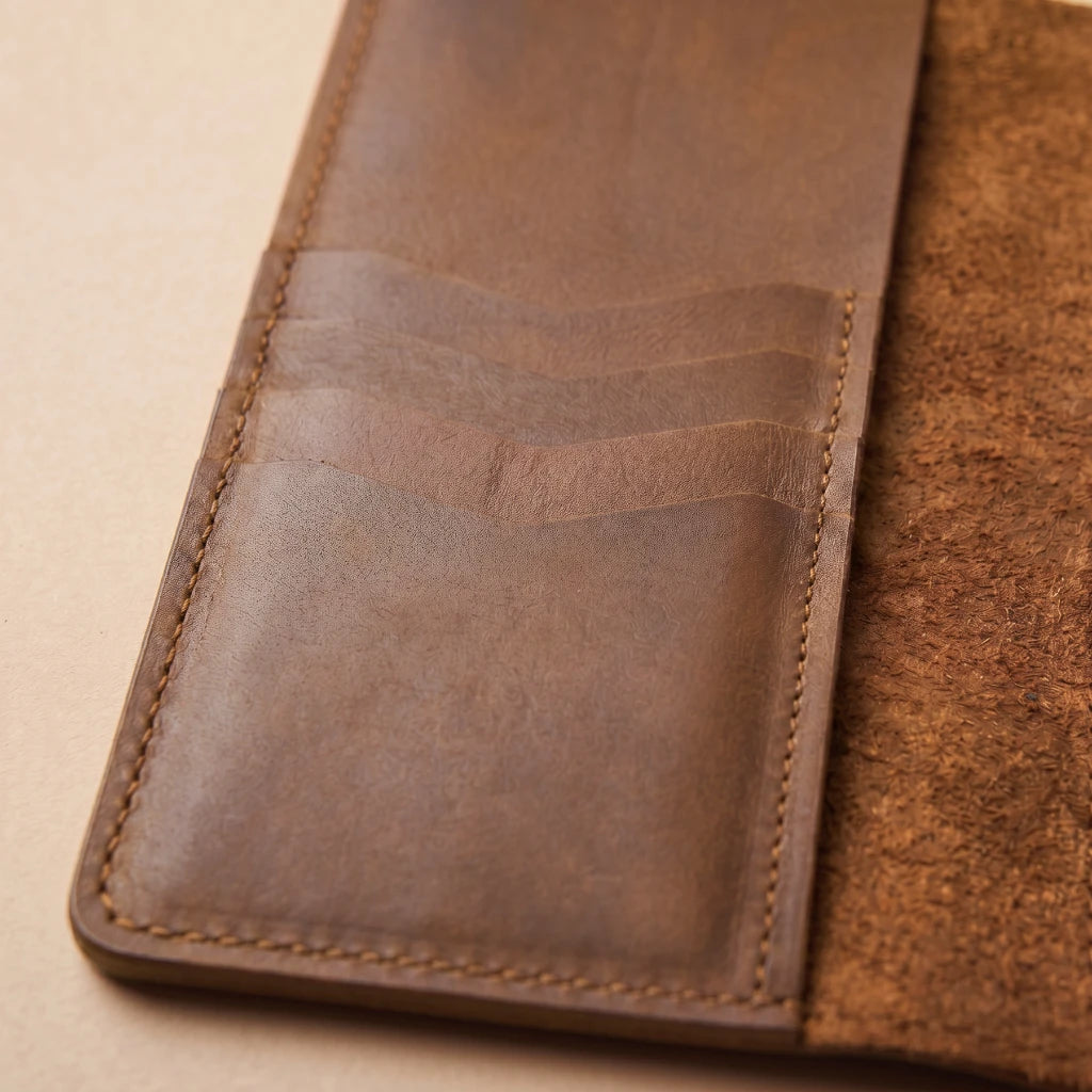 Refillable leather organizer built to carry journals and accessories