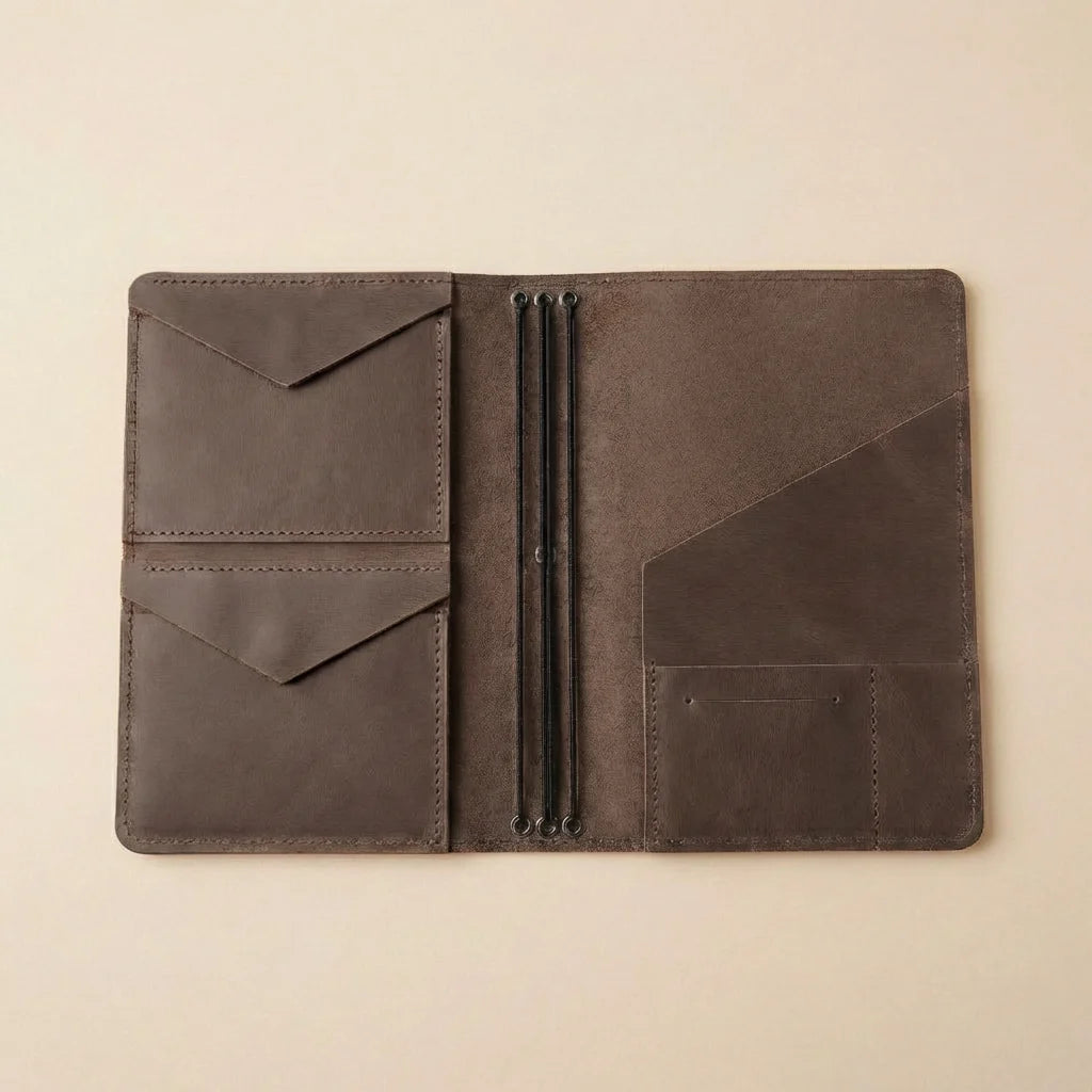 Brown leather journal cover on a beige background