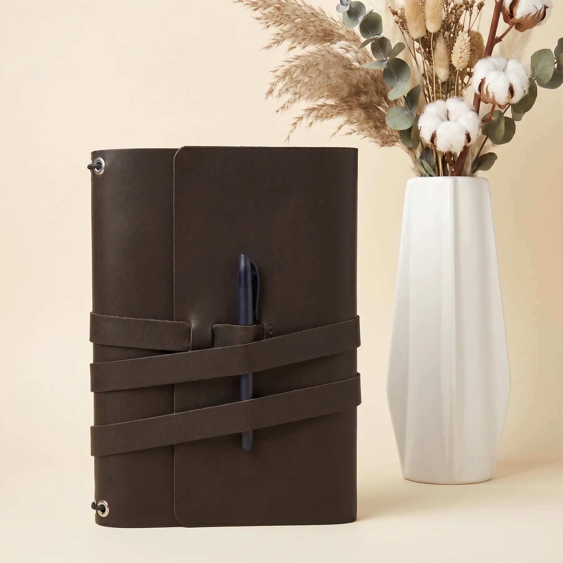 Elegant genuine leather notebook cover with pen loops for journals, planners, and notebooks.