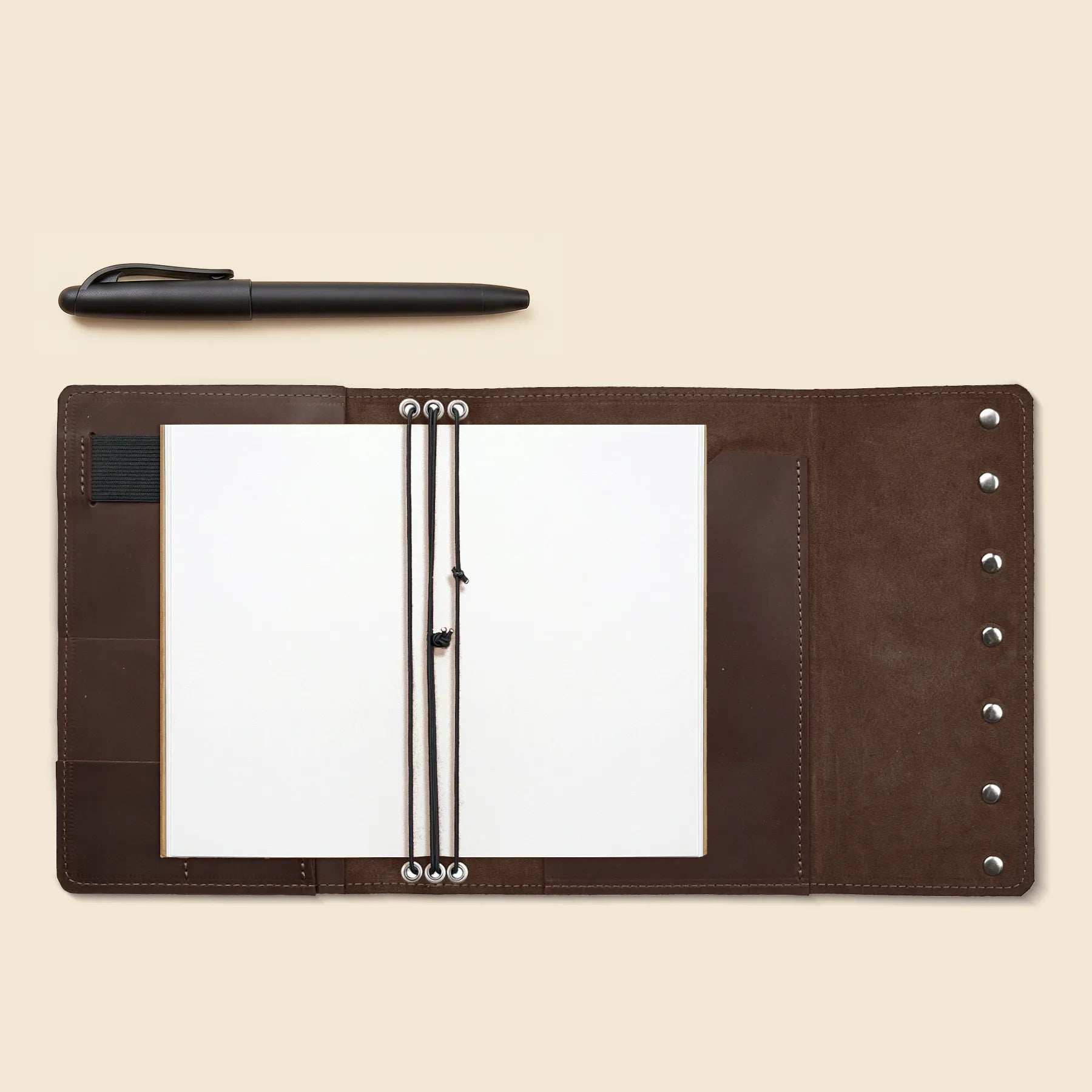 Rustic leather journal cover with organizer pockets and notebook elastic bands.