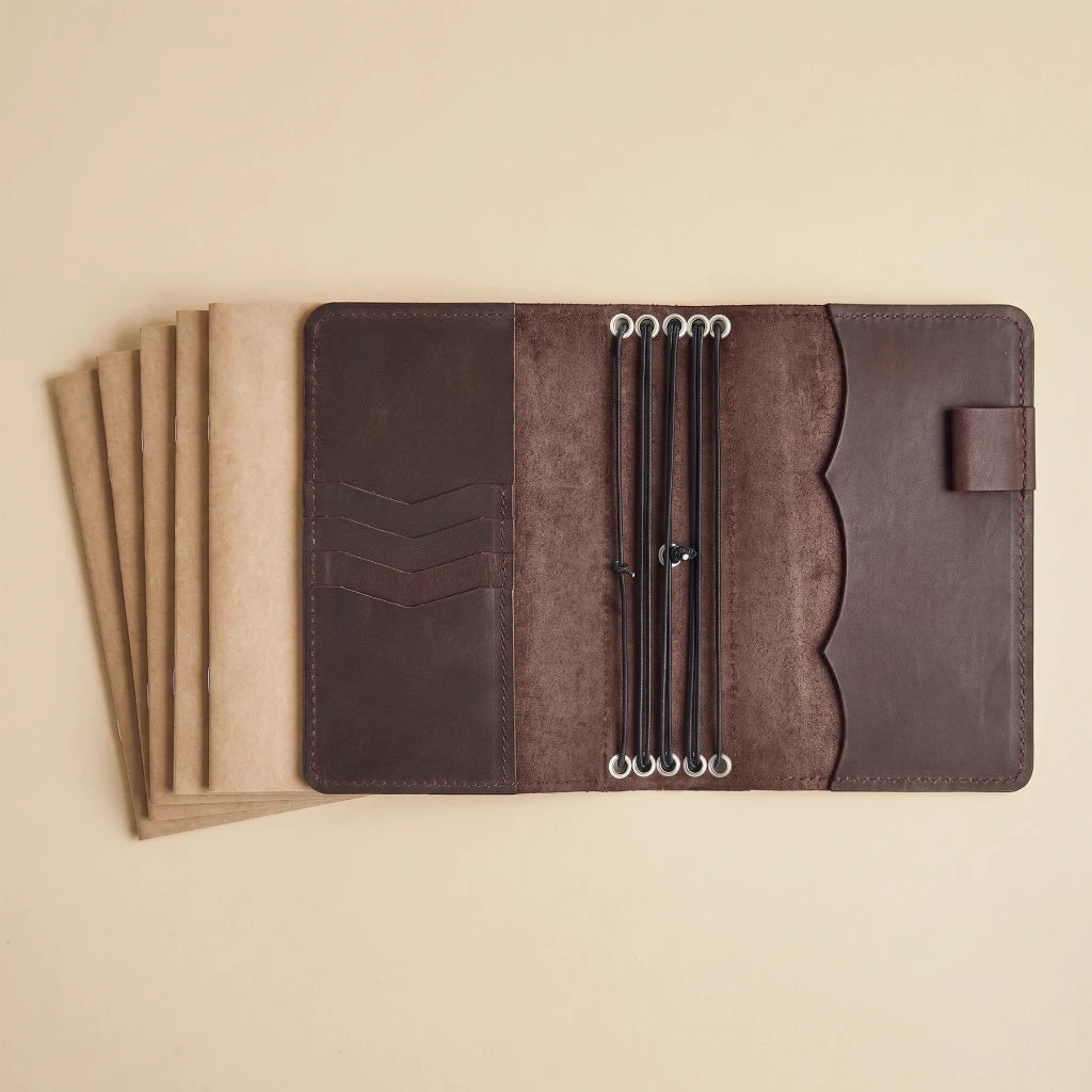 Handcrafted leather journal keeper with expandable notebook organization