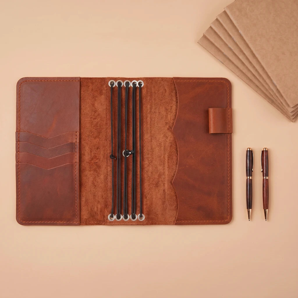 Elegant journal cover with secure notebook retention and card storage