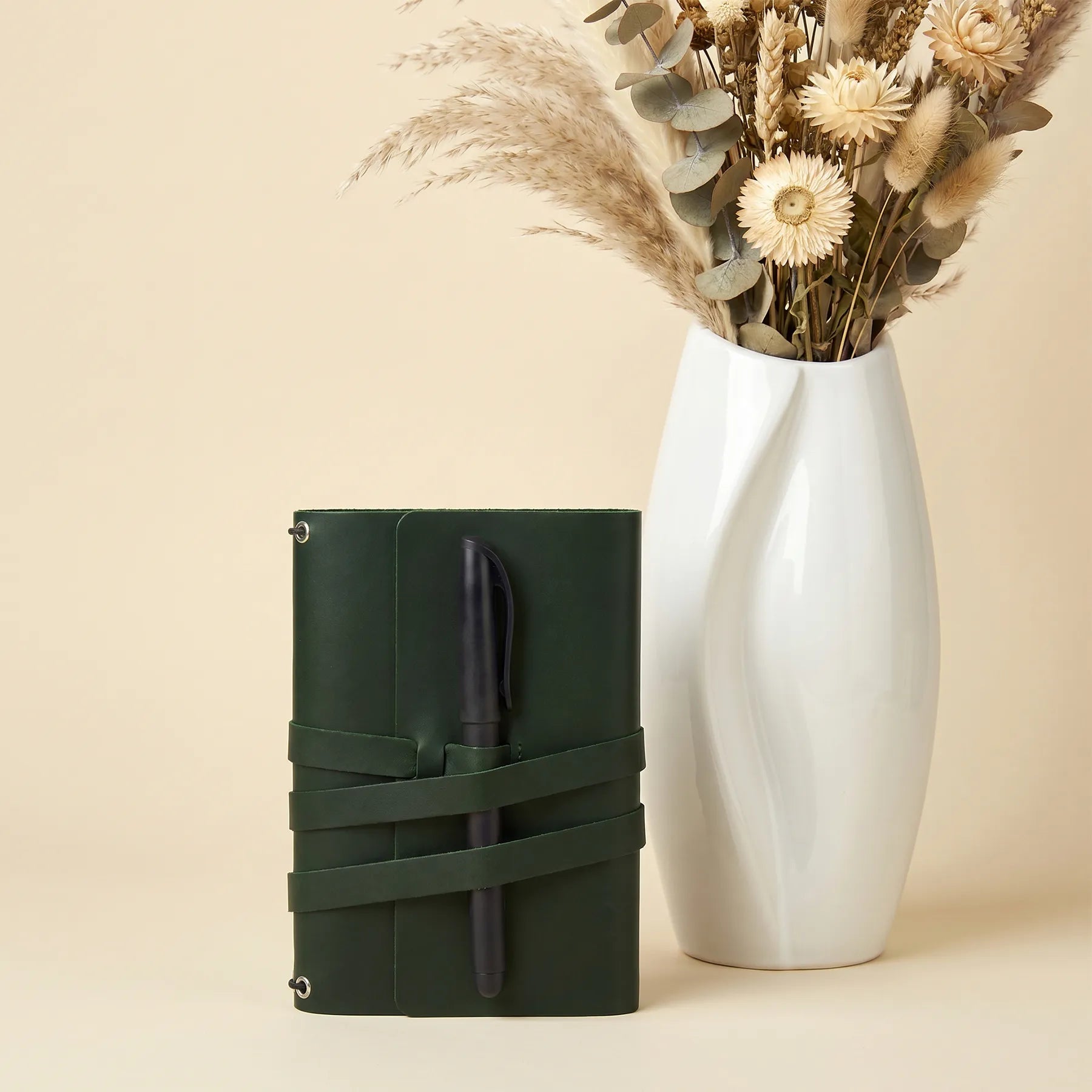 Minimalist leather notebook cover handcrafted from genuine leather with convenient pen loops.
